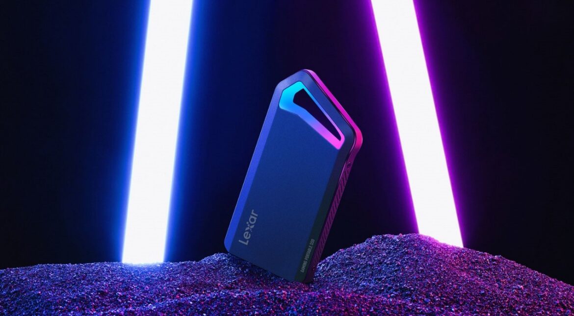 Lexar SL660 Blaze Portable SSD device for gaming, on gravel, bright purple lights in background