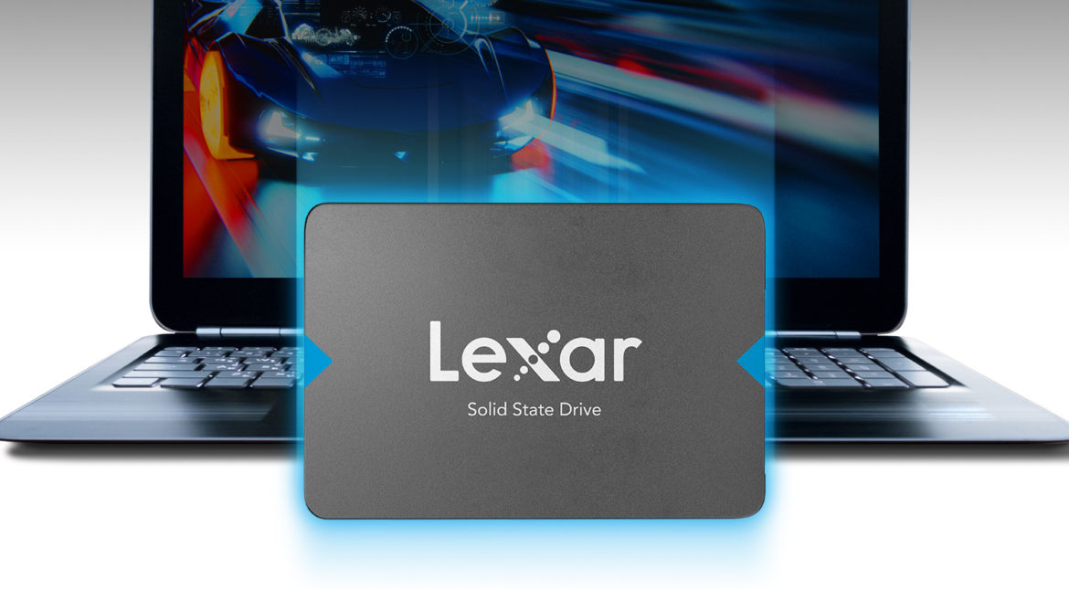 grey Lexar NQ100 2.5” SATA III SSD device sitting in front of laptop with luxury car on screen